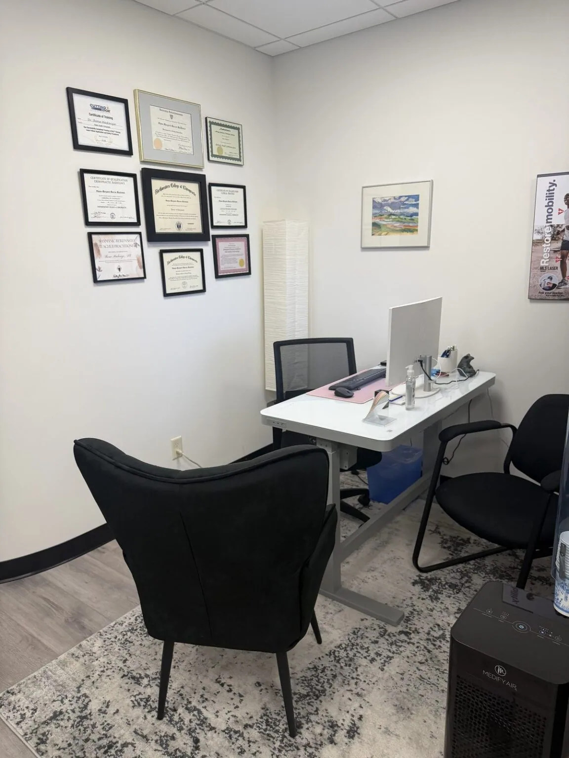 Dr. Shona’s consultation office, with her diplomas on the wall