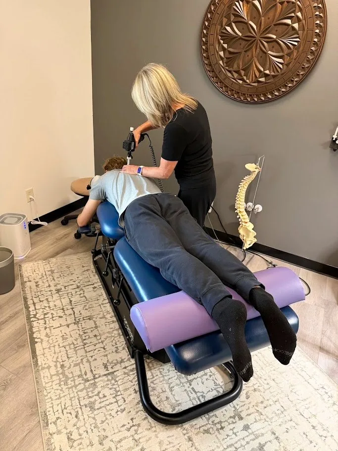 Dr. Shona adjusting a patient with the ArthroStim