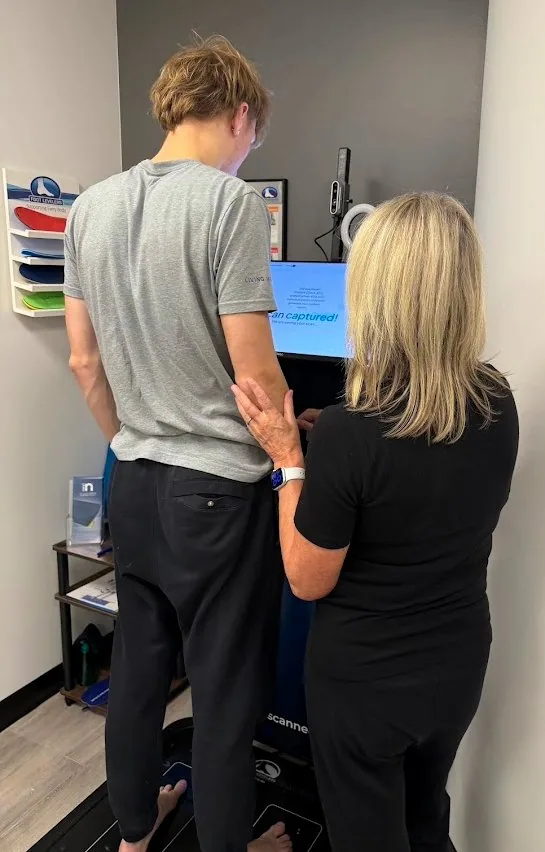 A patient on the 3D foot scanner for custom orthotics