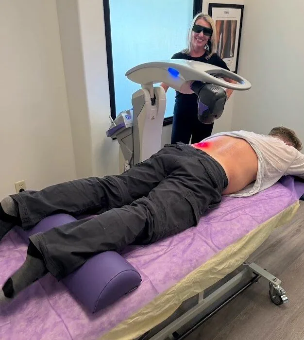 MLS M7 laser treatment on a patient’s lower back