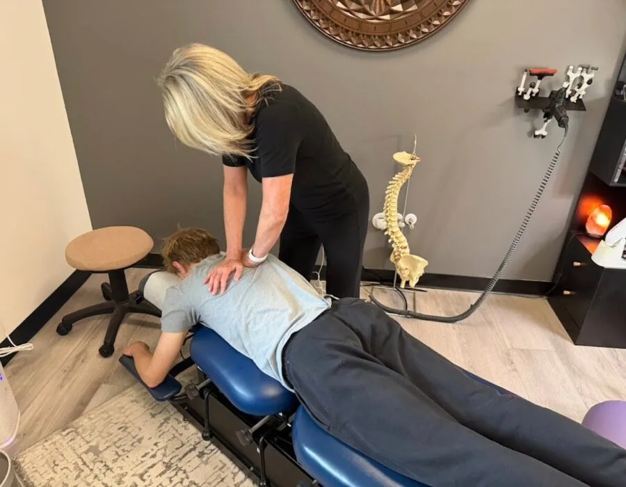 Dr. Shona giving a thoracic adjustment