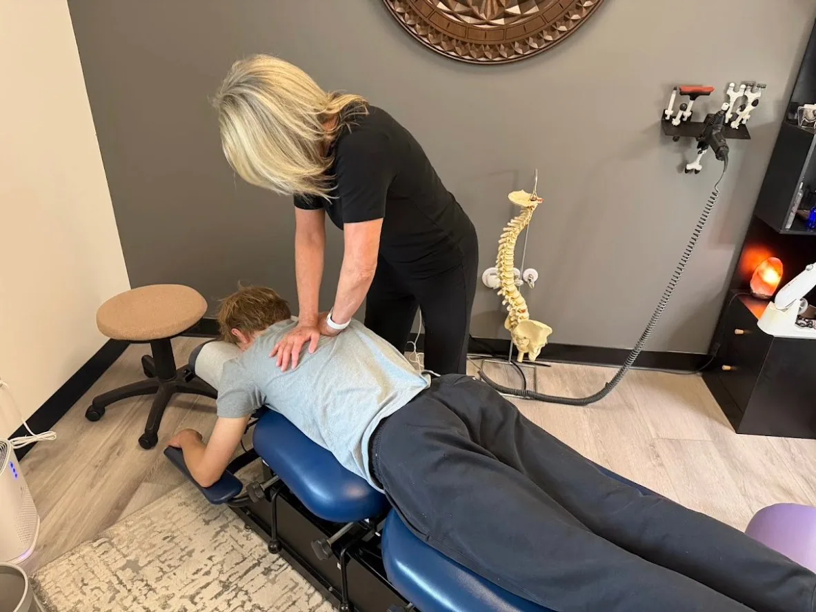Dr. Shona giving a thoracic adjustment